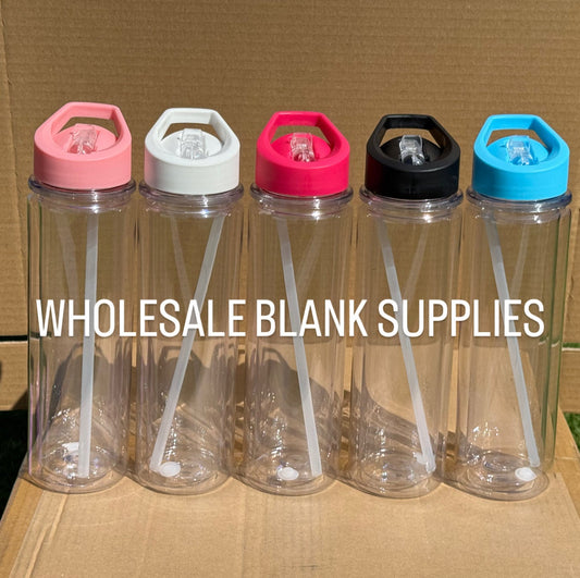 Clear plastic bottles with colorful lids on a cardboard box, labeled 'Wholesale Blank Supplies'.